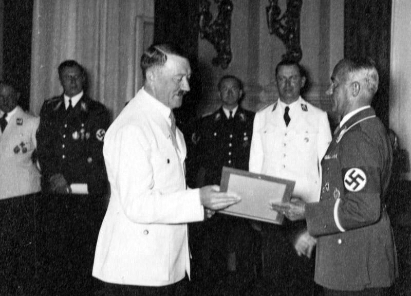 Adolf Hitler congratulates Hans von Tschammer und Osten on his 50 Birthday reception in the Reich Chancellery